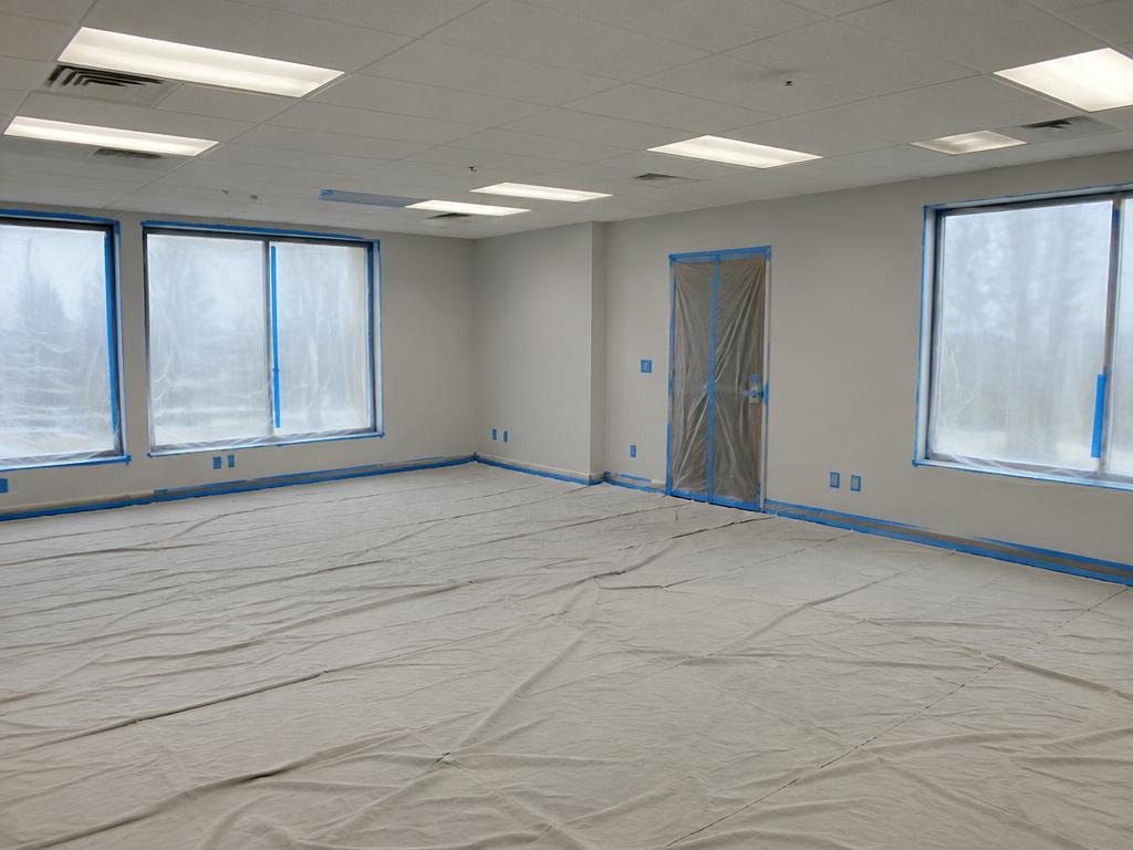 Commercial space masked and covered before painting