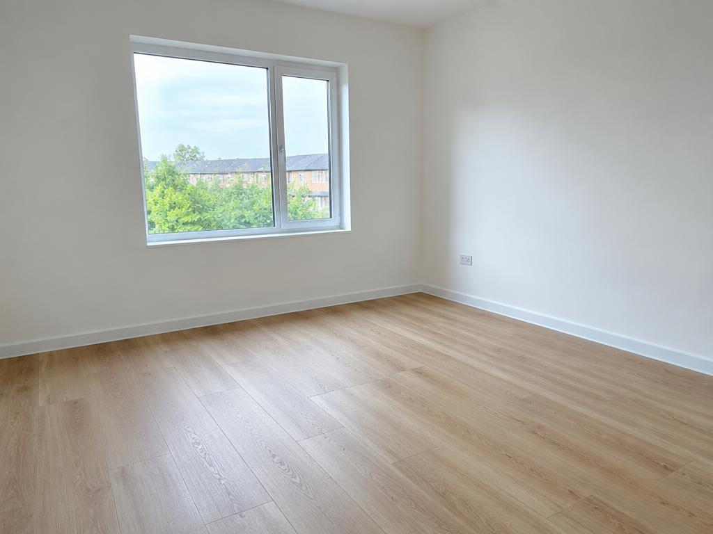 Empty room with laminate flooring